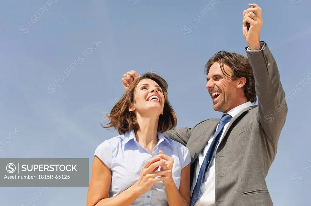 Business people cheering