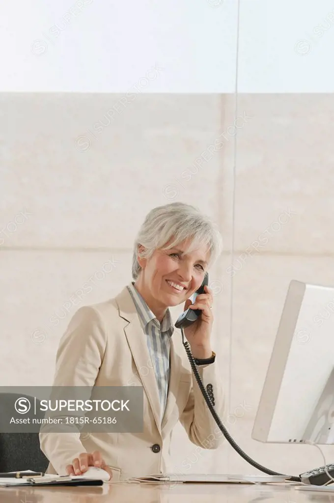 Senior woman using telephone