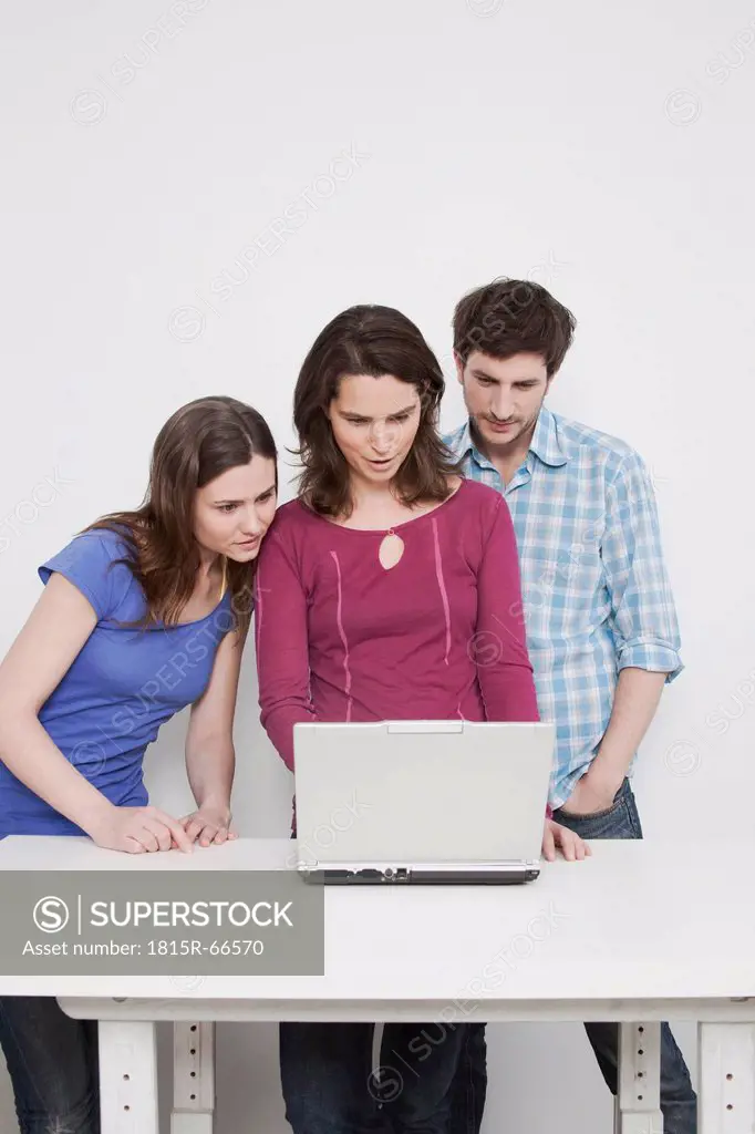 Man and women using laptop