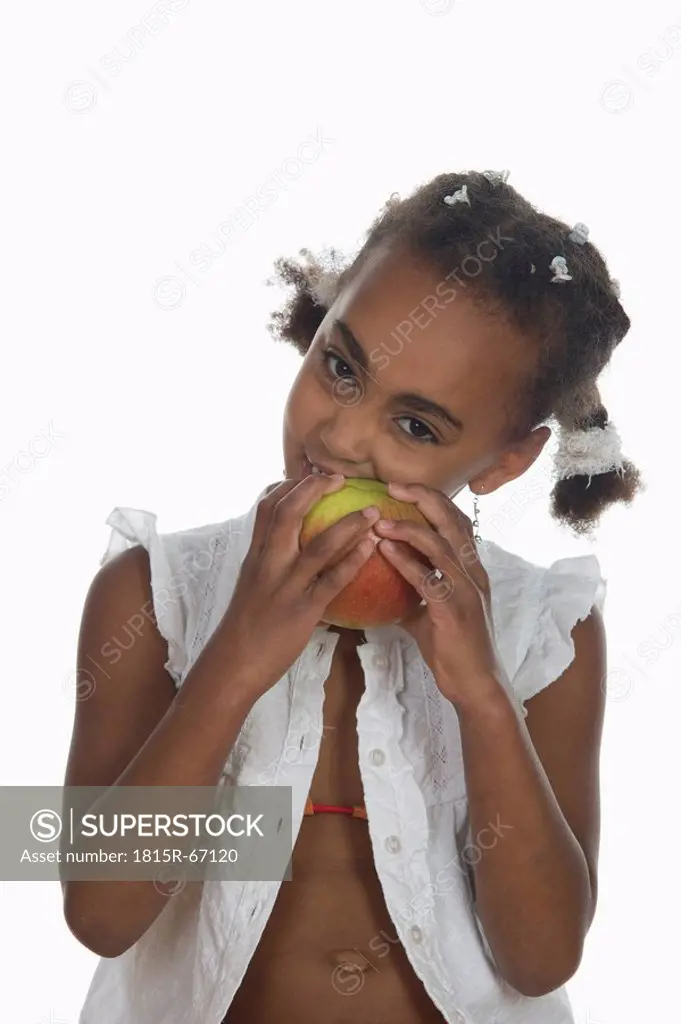 African girl 6_7 biting into apple, portrait