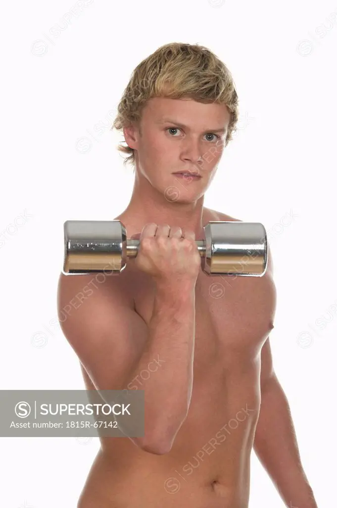 Young man exercising with a dumbbell, portrait, close_up