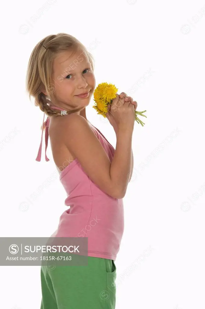 Girl 10_11 holding dandelion flowers, side view, portrait