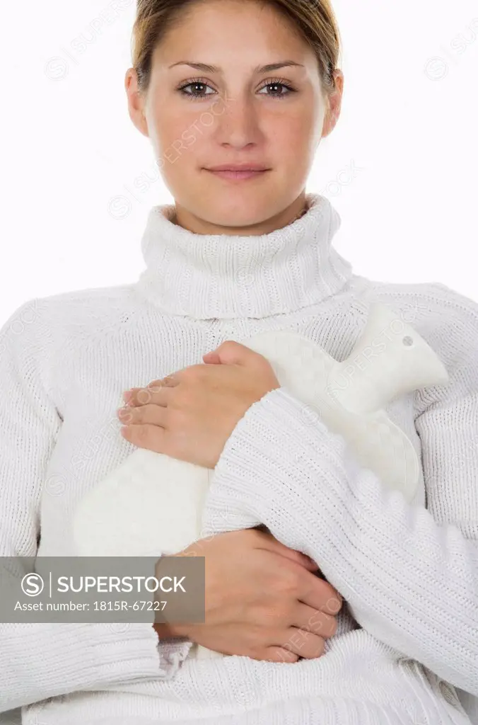 Young woman holding hot_water bottle