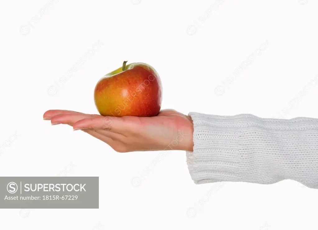 Person holding an apple