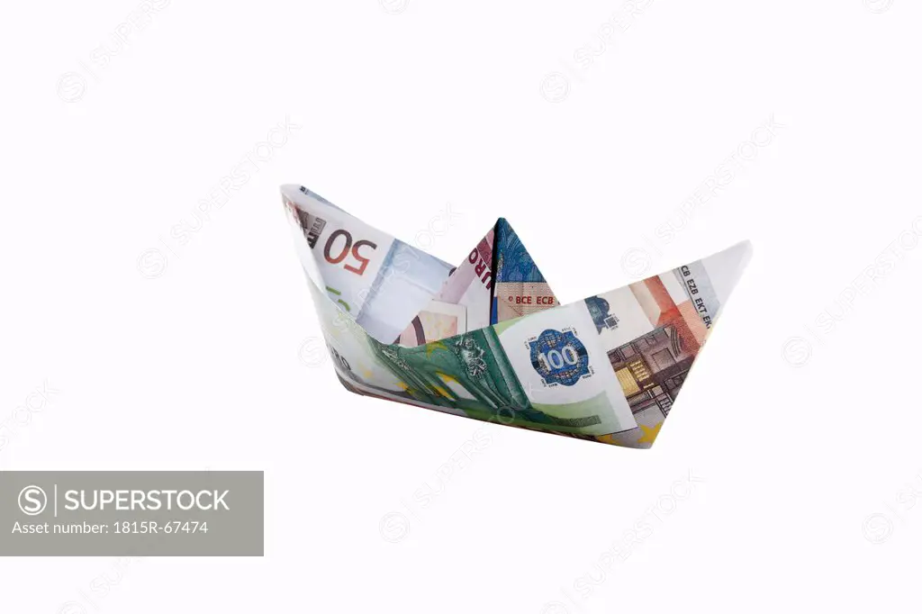 Origami paper boat of euro notes on white background