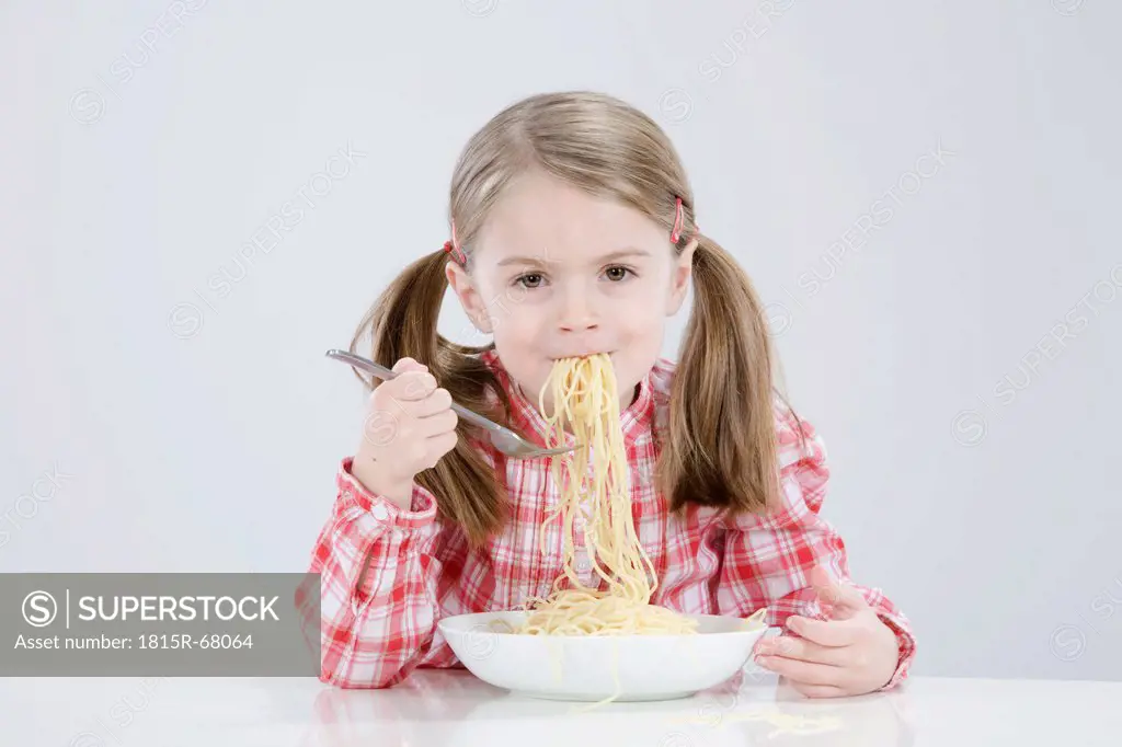 Girl 4_5 eating spagetti, smiling, portrait