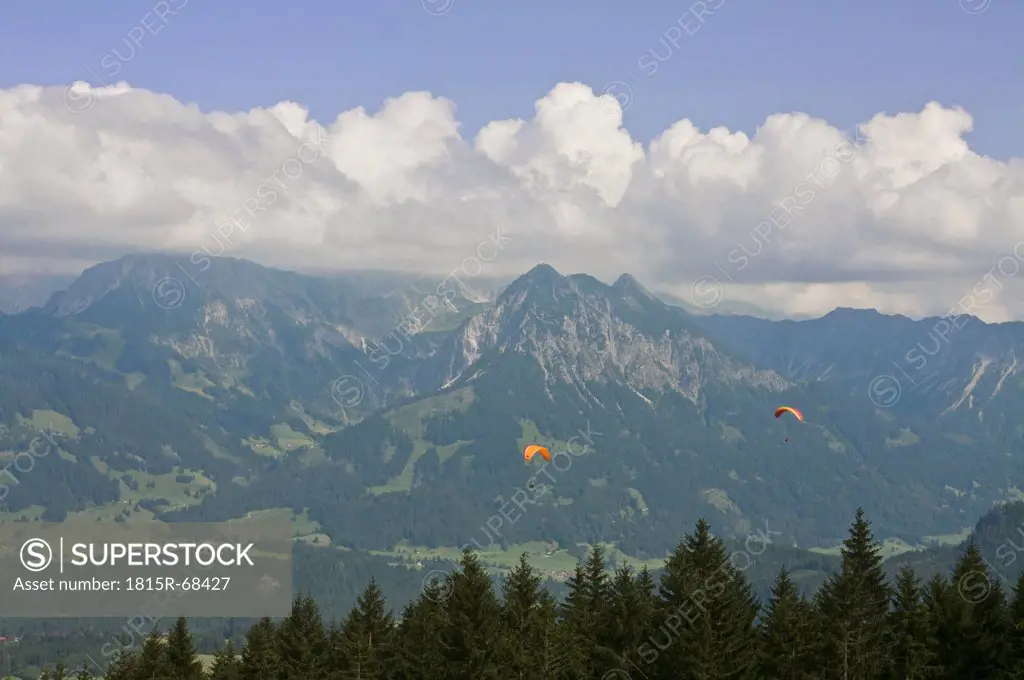 Germany, Allgaeu, Bavaria, View of hang_gliding fying over fischen area