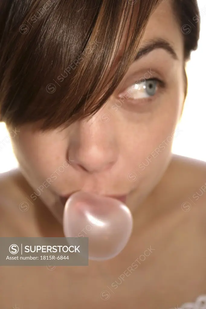 Woman doing chewing gum bubble