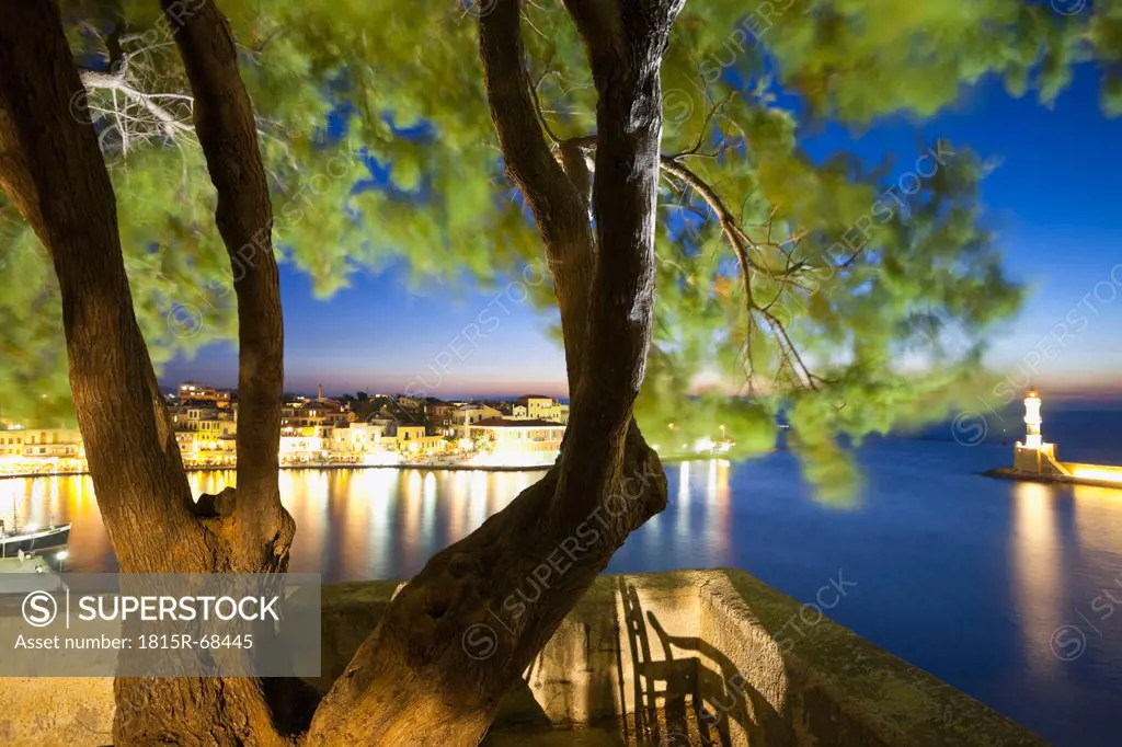 Greece, Crete, Chania, View of tree with city in background