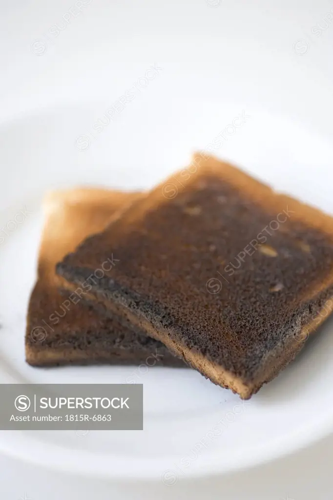 Two slices of burned toast, close-up
