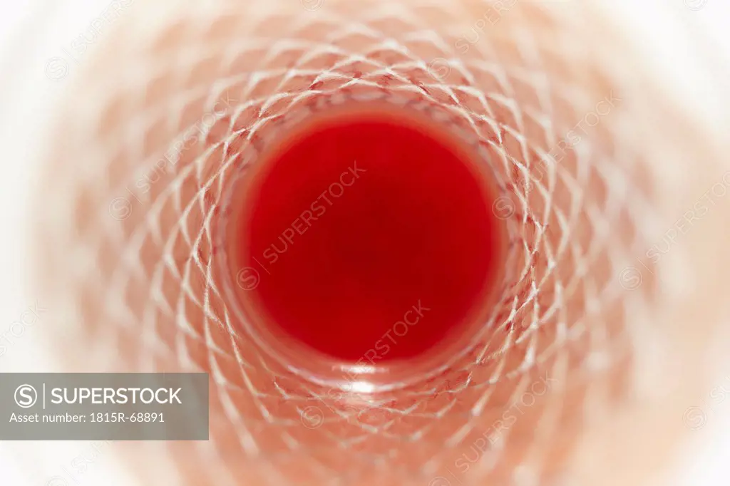 Remaining of tomato juice in crystal glass, close up
