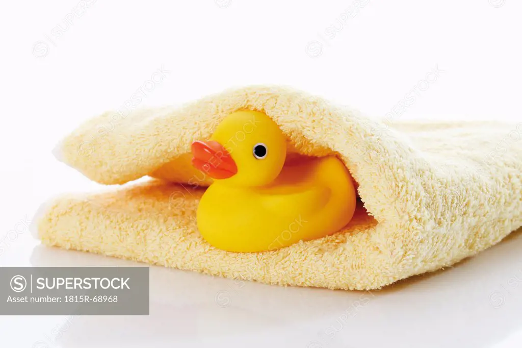 Close up of rubber duck on towel