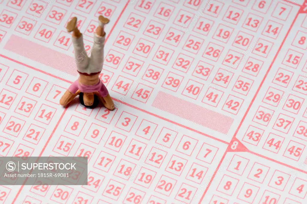 Miniature headstands on lottery ticket