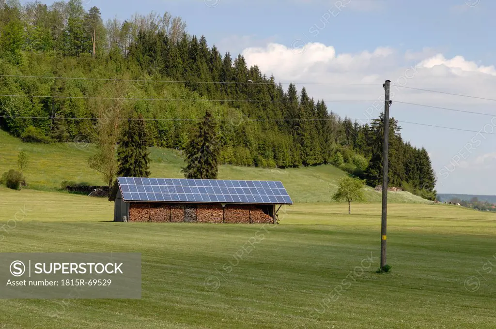 Germany, Bavaria, Wood shack with solar cell roof