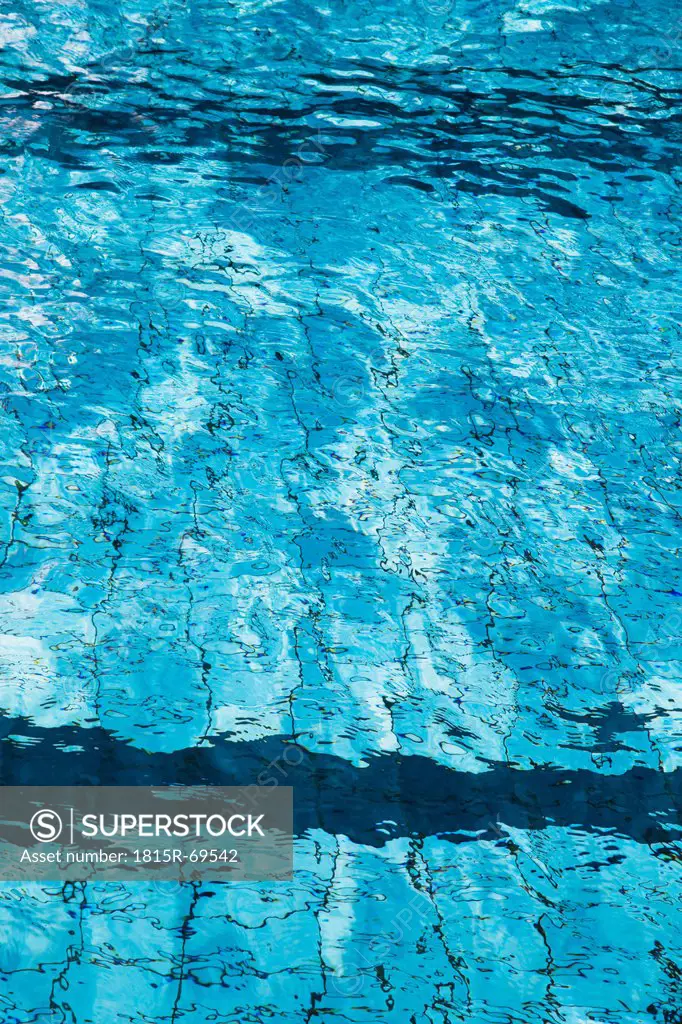 Water rippling in swimming pool, close up