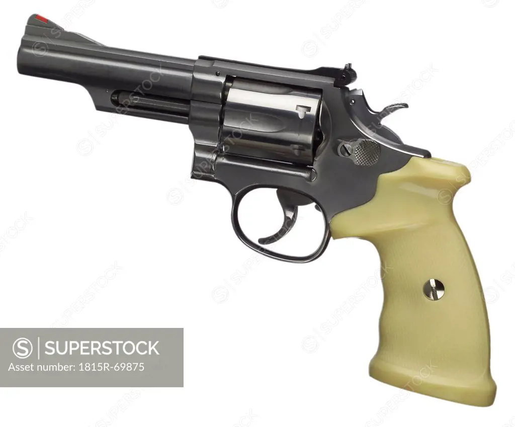 Close up of revolver against white background