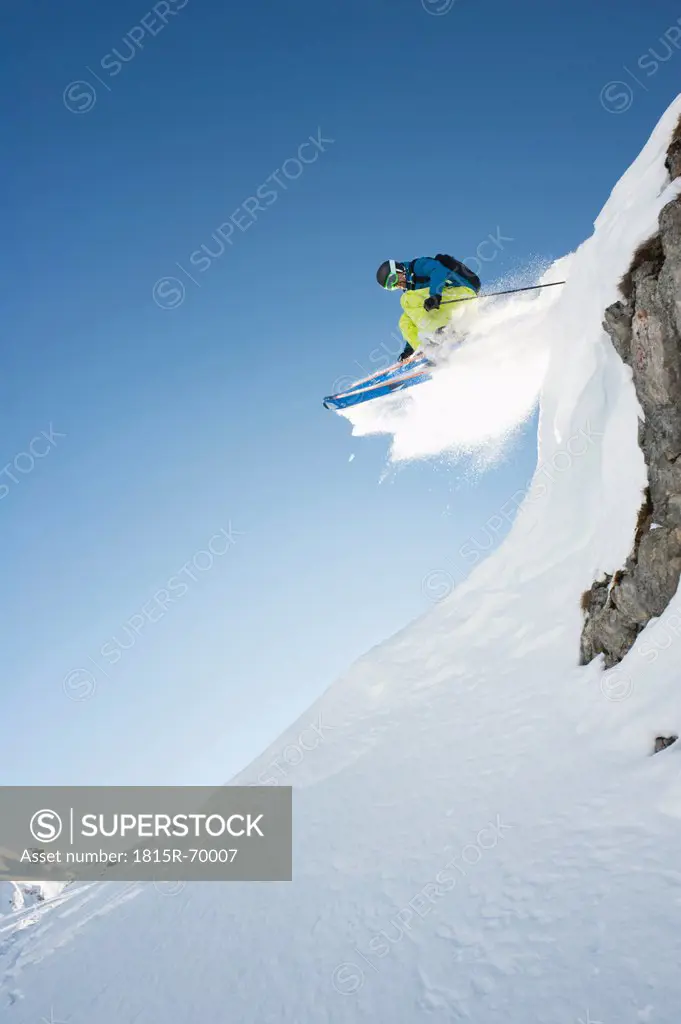 Austria, Man jumping on arlberg mountain