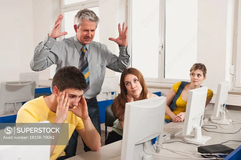 Germany, Emmering, Lecture shouting at students in computer lab