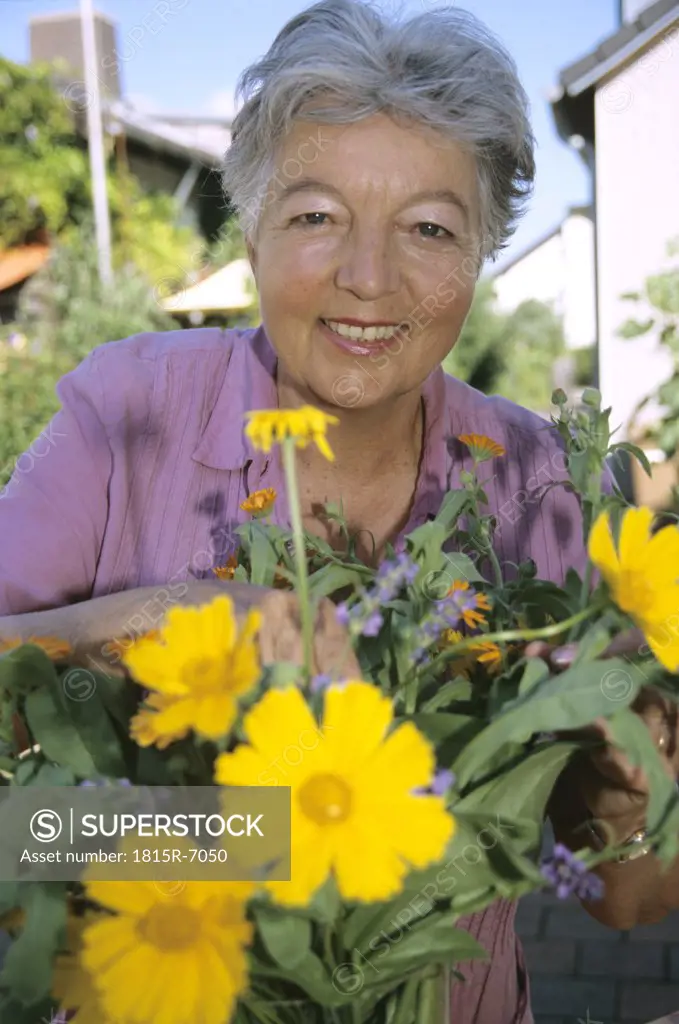 Senior woman working in her garden