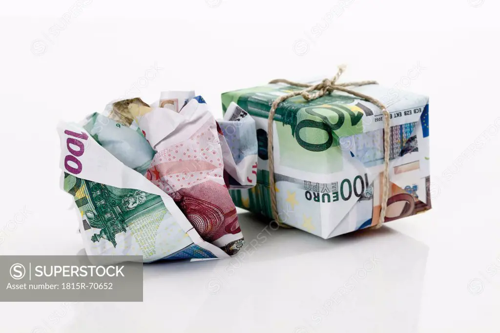 Crumpled euro notes with money parcel