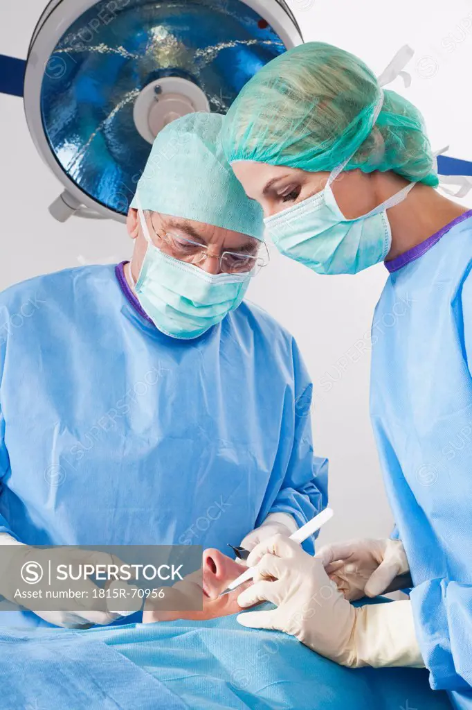 Germany, Munich, Surgeons performing operation