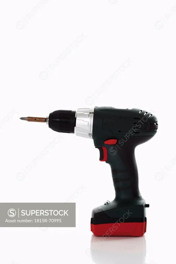 Cordless drill against white background