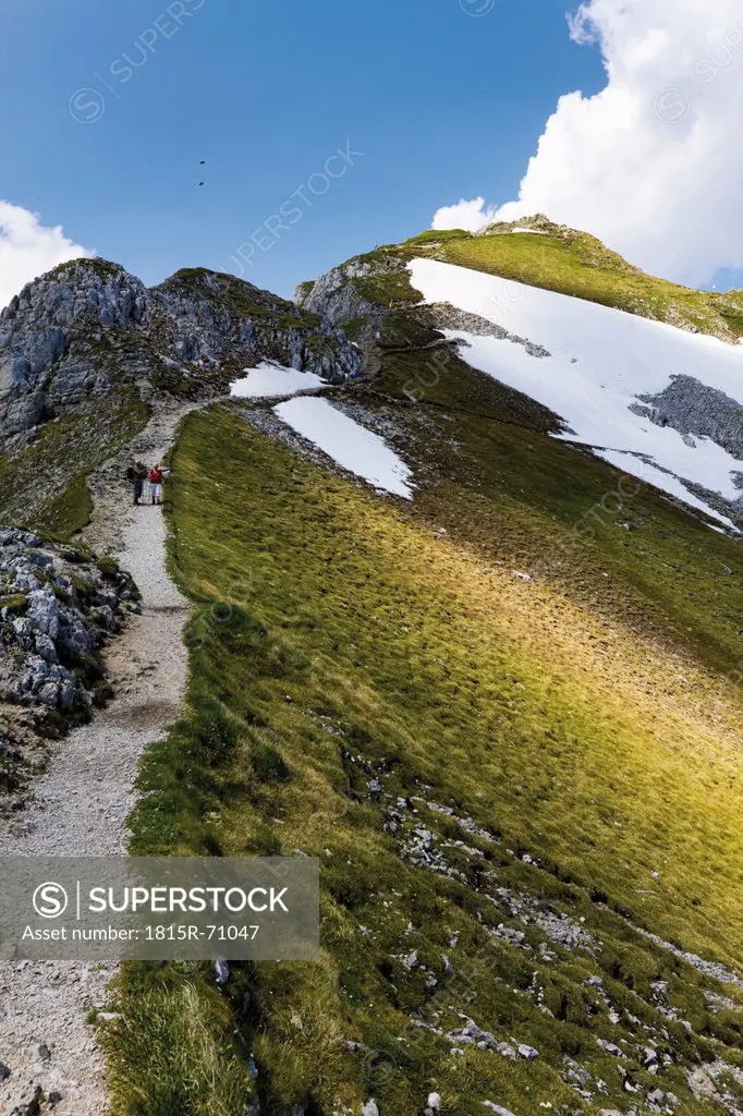 Germany, Bavaria, Karwendelspitze, Hiker walking through Karwendel mountains