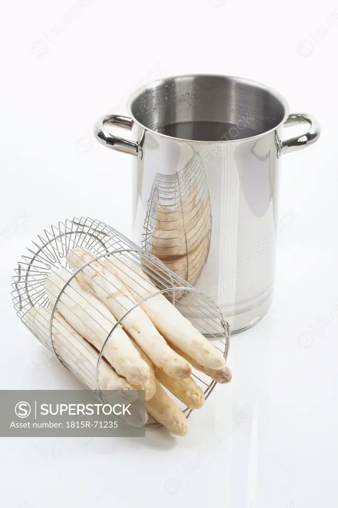 White asparagus with cooking pot on white background