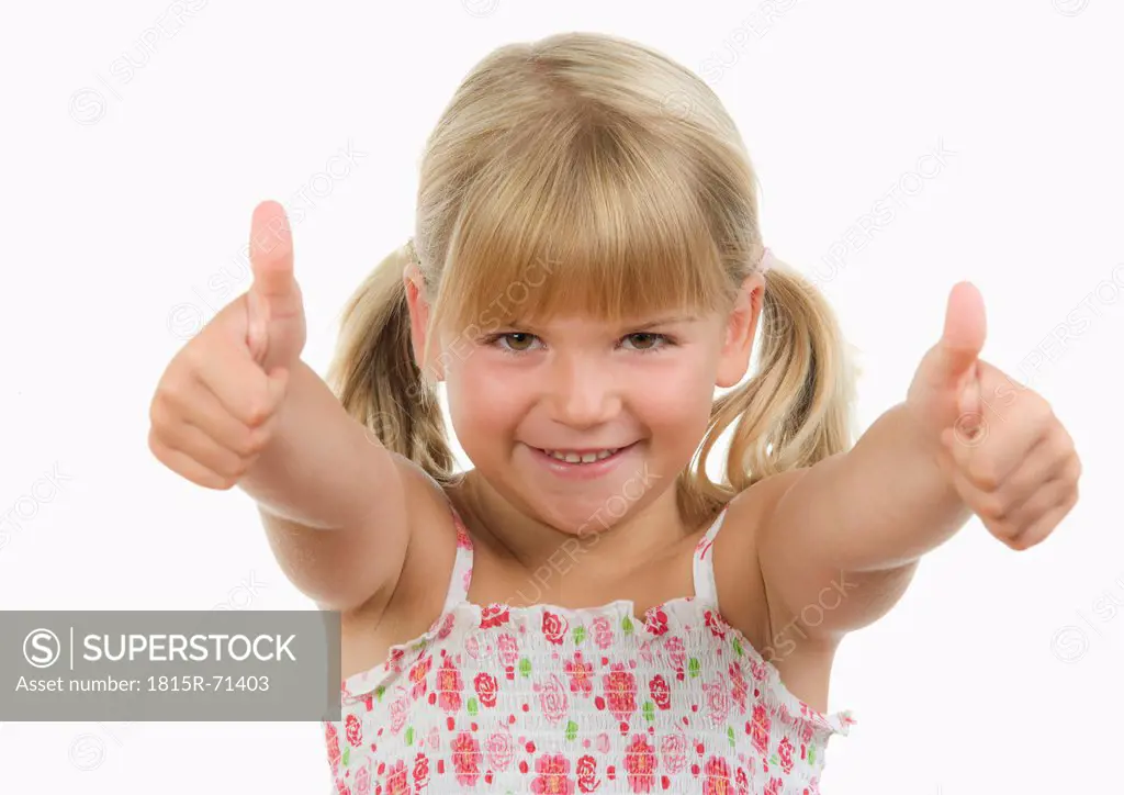 Girl 4_5 showing thumbs up sign, smiling, portrait