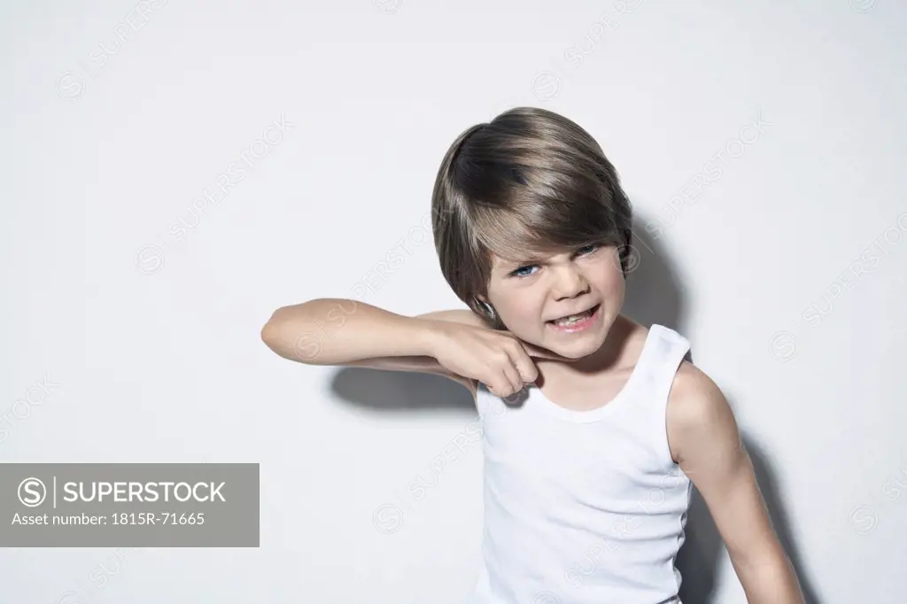 Boy 8_9 gesturing against white background