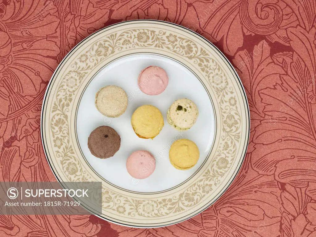 Petit fours in plate against patterned background