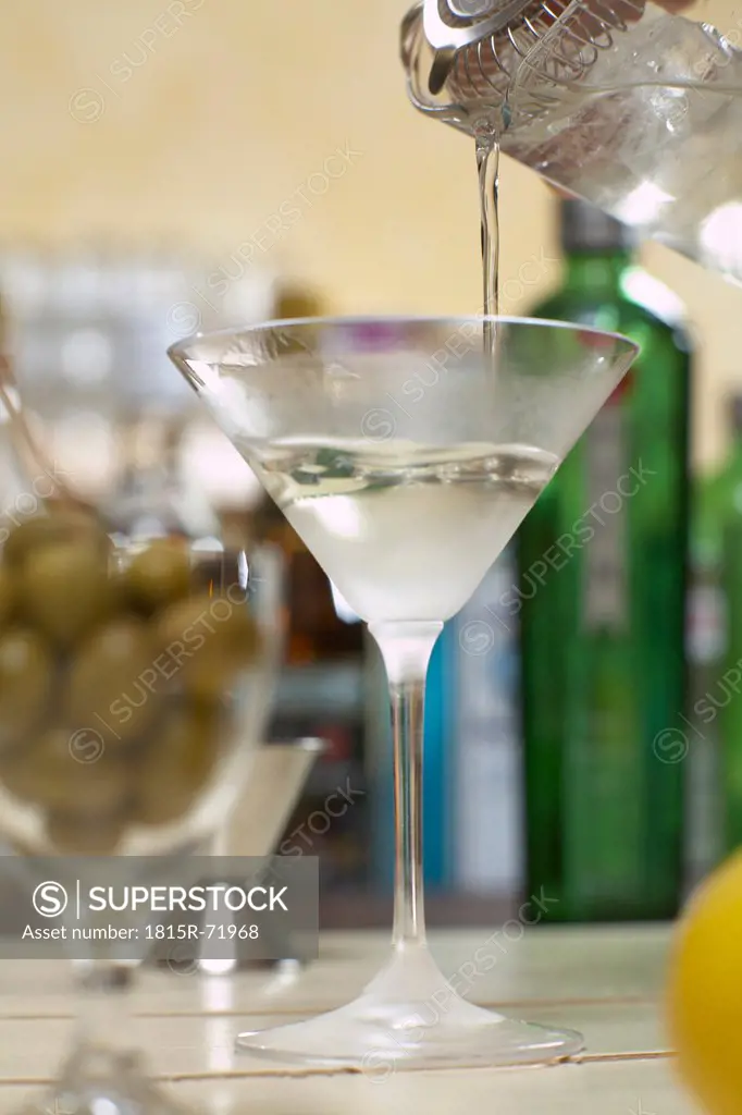 Martini poured into martini glass, close up.