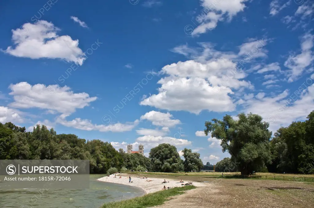 Germany, Bavaria, Munich, People at river isar with st. maximilian church in background