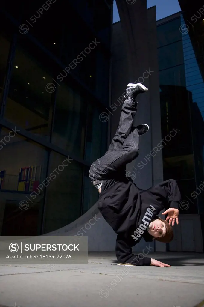 Man performing break dancing, portrait.