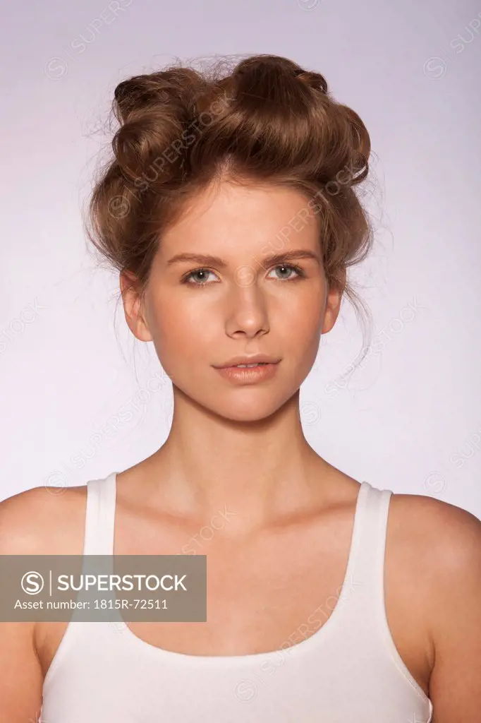 Young woman wearing hair curlers, close_up