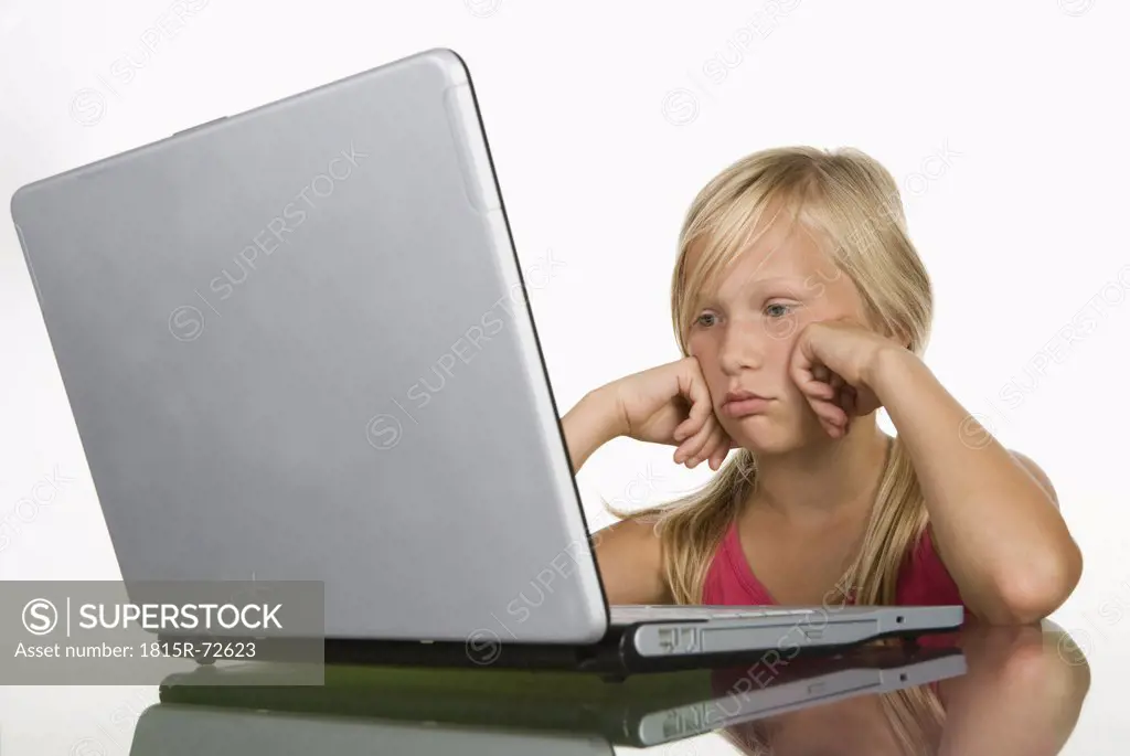 Girl 10_11 looking at laptop, close up