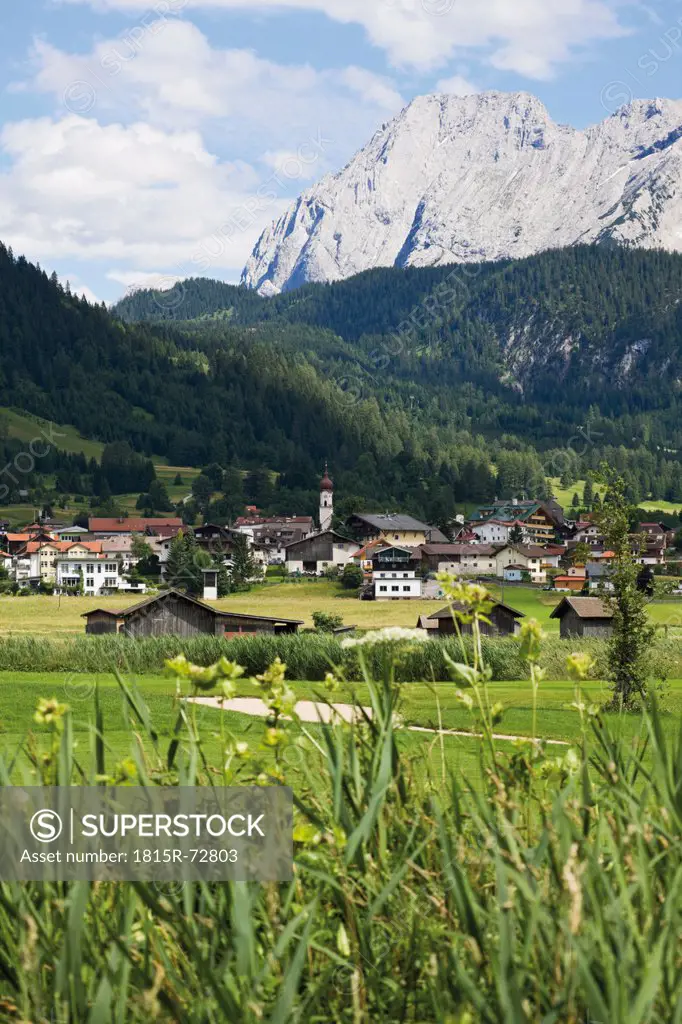 Austria, Tyrol, Mieming, Ehrwald, View of village with mountain ranges