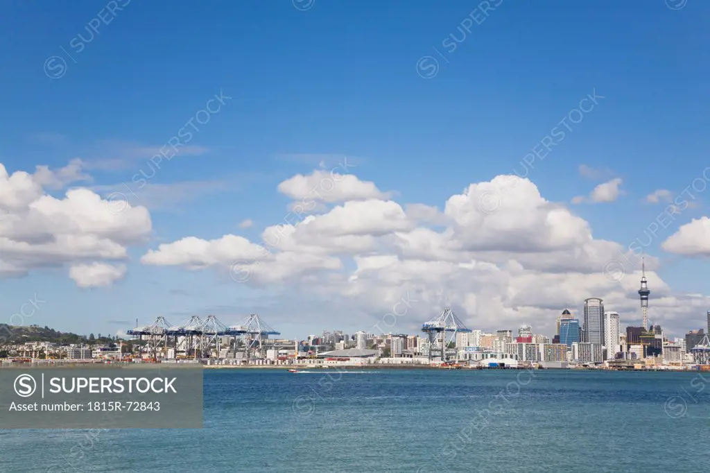 New Zealand, Auckland, North Island, View of city skyline with harbour terminals