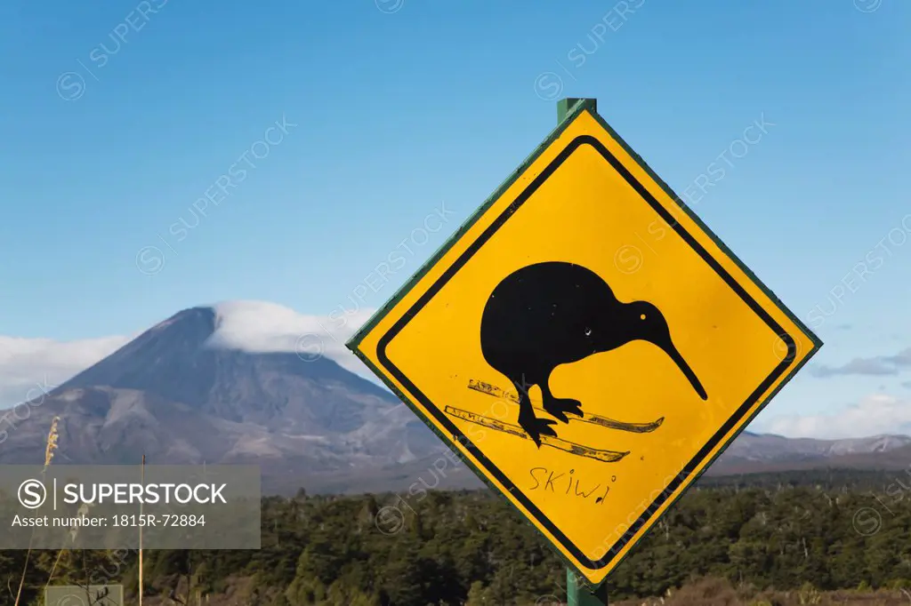New Zealand, North Island, Animal crossing sign with mount ngauruhoe in background