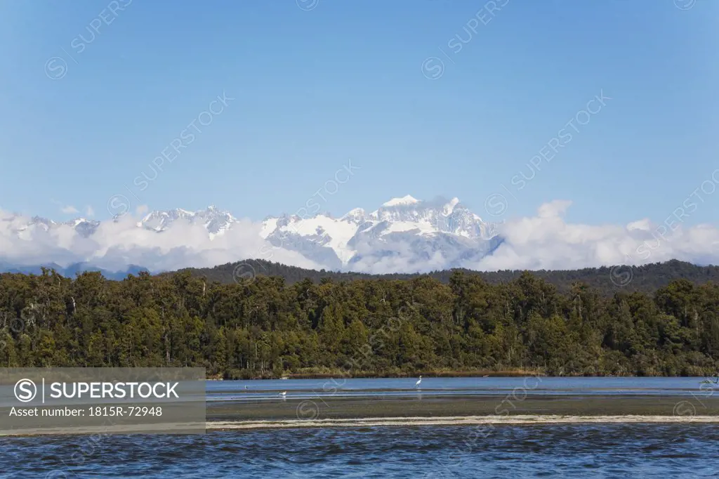 New Zealand, South Island, West Coast, View of Okarito Lagoon with mountains in background