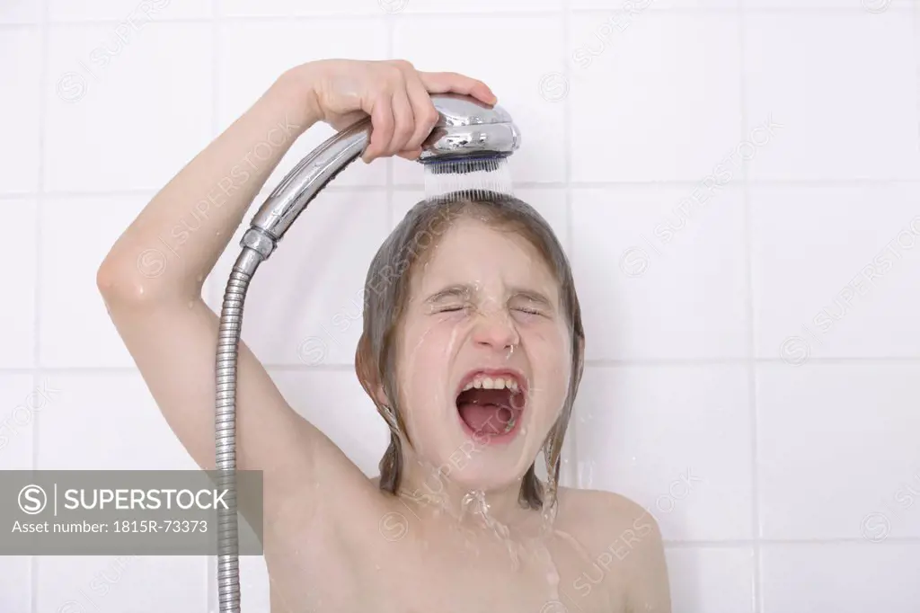 Boy 12_13 years having bath
