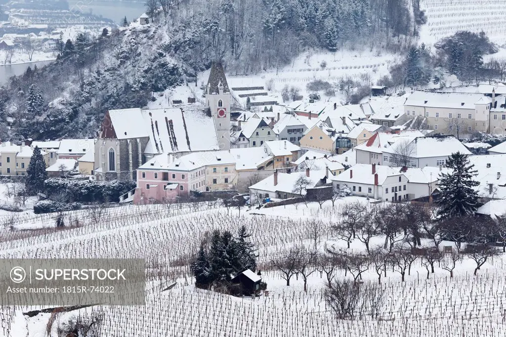 Austria, Lower Austria, Spitz, Wachau, Waldviertel, View of snow covered vineyards with buildings