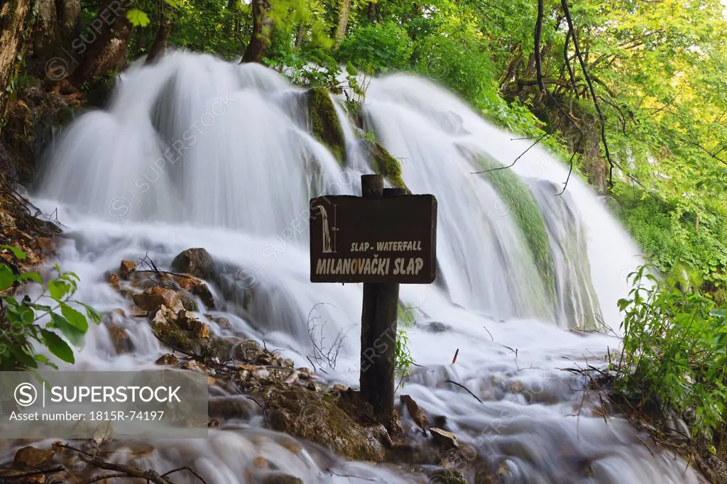 Europe, Croatia, Jezera, View of waterfall with milanovacki slap board sign