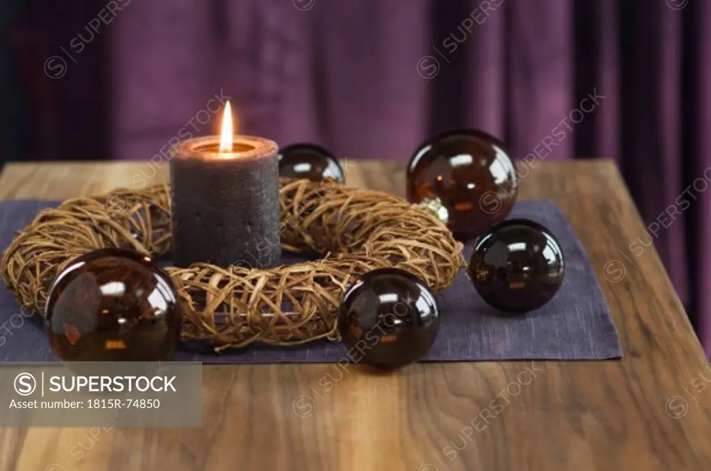 Close up of advent wreath with christmas bauble and candle