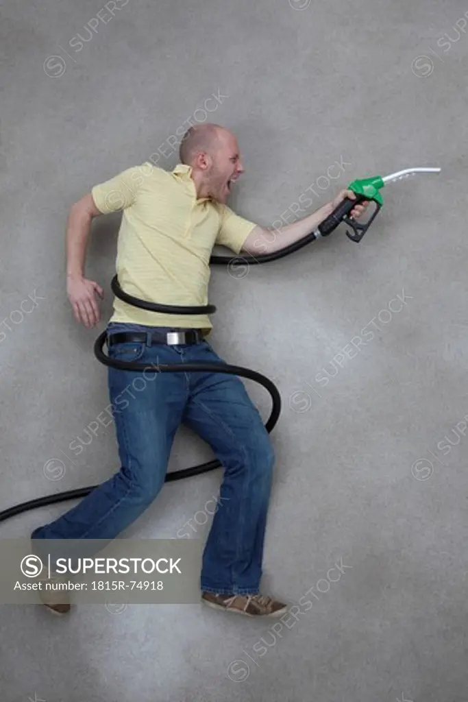 Young man with industrial hose