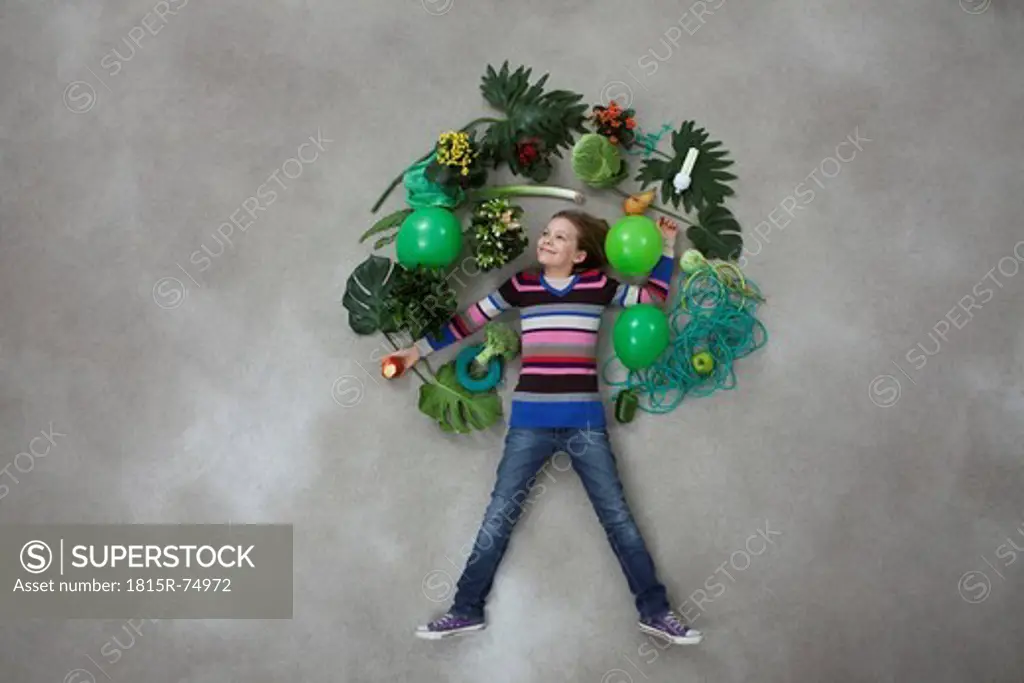 Girl forming tree shape on gray background