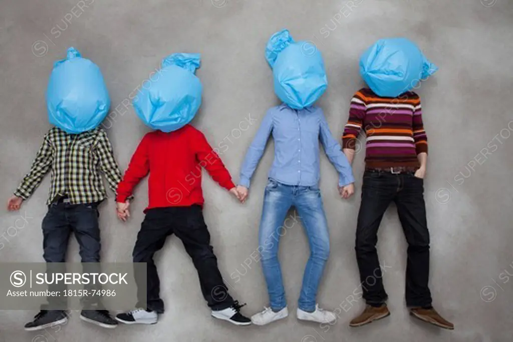 People covering their faces with plastic bags and showing ecology symbol