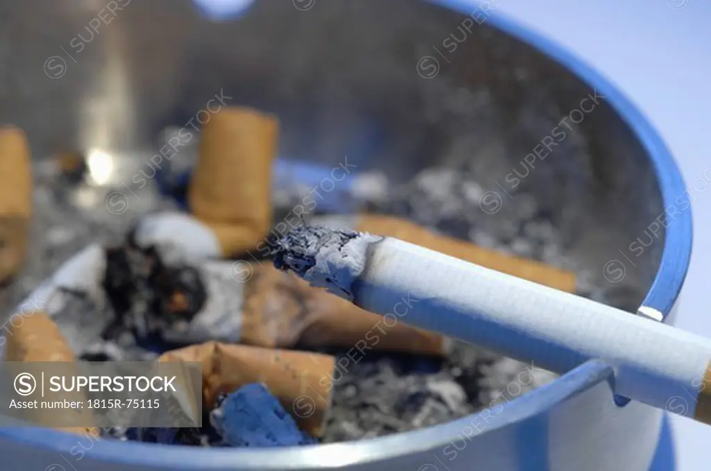 Cigarette on ashtray, close up