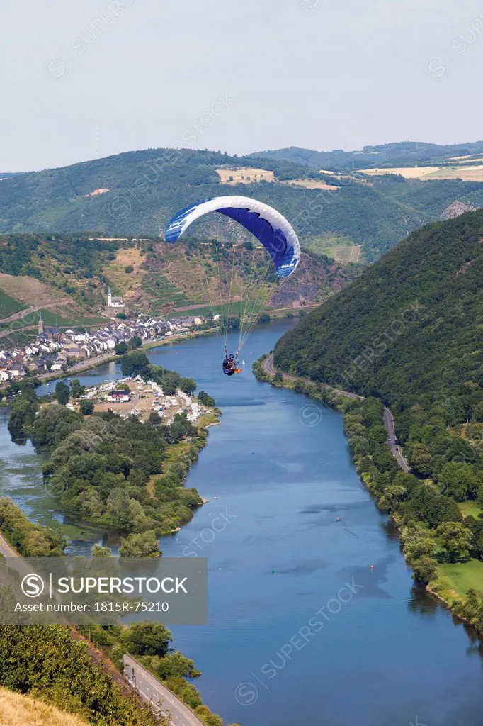 Germany, Moselle, Hatzenport, Person parachuting over village