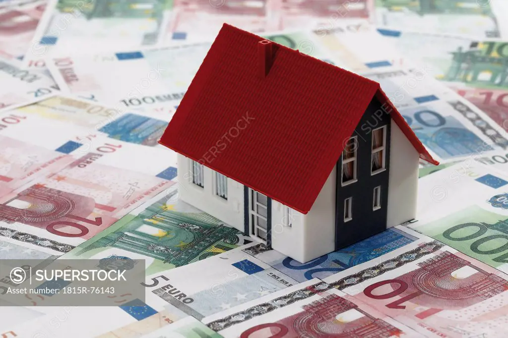 Model house on Euro bank notes